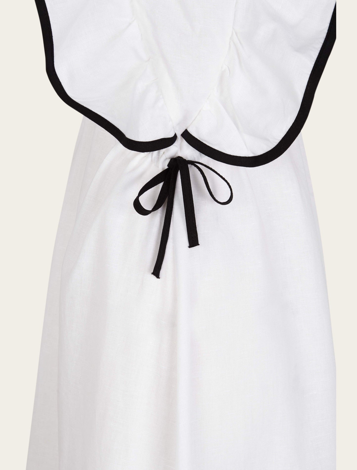 Black trimmed white dress