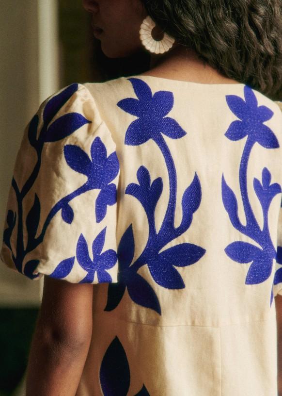 blue flower and white dress